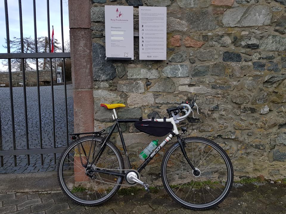 Frankenstein lening on Frankenstein castle wall, facing right..